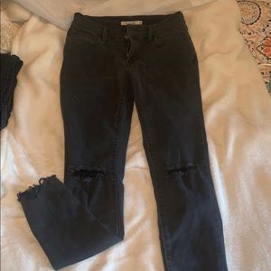 Black ripped super skinny jeans